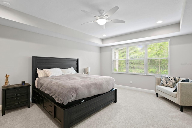 bedroom with ceiling fan and light colored carpet