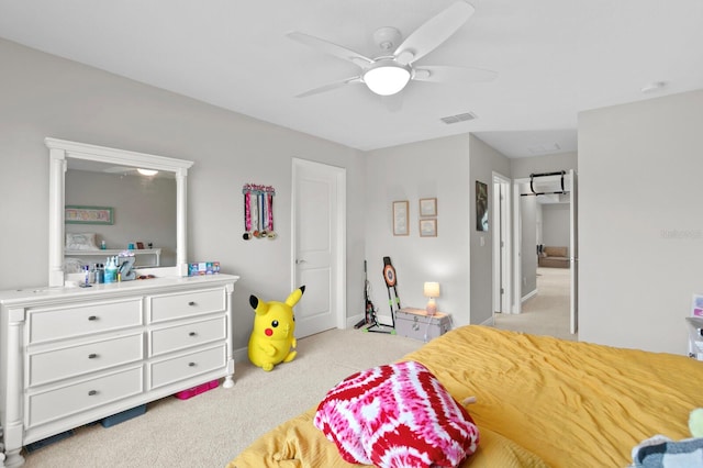 bedroom featuring light carpet and ceiling fan