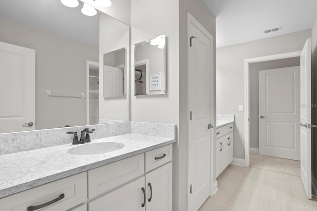 bathroom featuring tile patterned floors and vanity