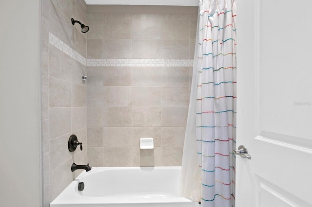 bathroom with shower / bath combination with curtain