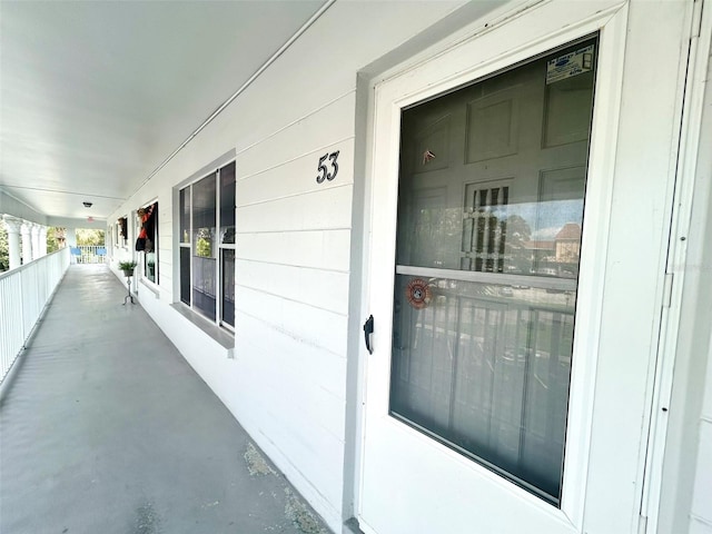 doorway to property with a porch