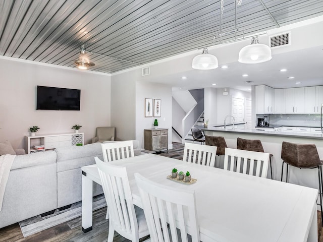 dining space featuring dark hardwood / wood-style floors