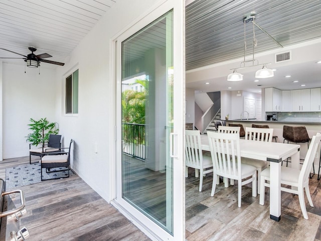 dining room featuring light hardwood / wood-style flooring and ceiling fan