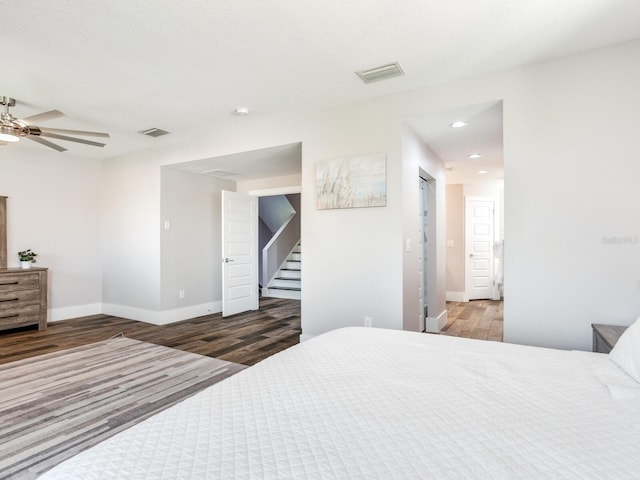 bedroom featuring ceiling fan and dark wood-type flooring