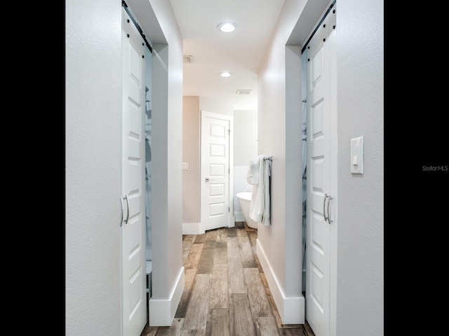 hall with light hardwood / wood-style flooring