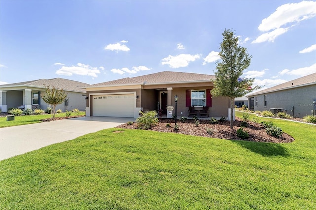 ranch-style home featuring a front lawn and a garage