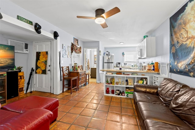 living room with ceiling fan, tile patterned flooring, and an AC wall unit