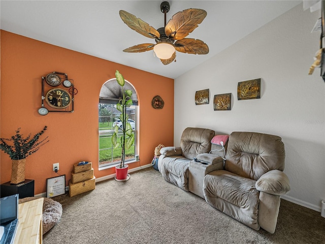 living room featuring lofted ceiling, ceiling fan, and carpet flooring