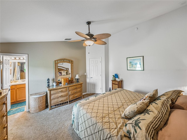 bedroom with carpet, vaulted ceiling, ceiling fan, and ensuite bathroom