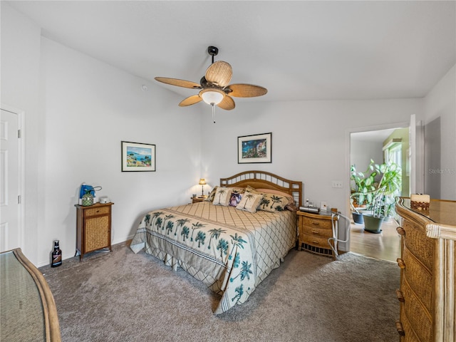 carpeted bedroom featuring ceiling fan and lofted ceiling