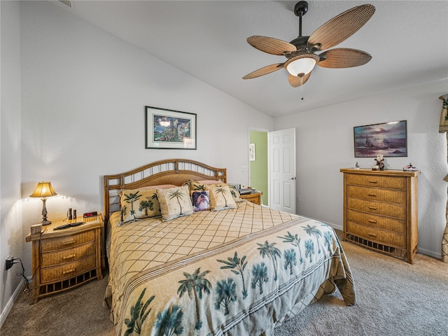 bedroom with vaulted ceiling, ceiling fan, and carpet floors