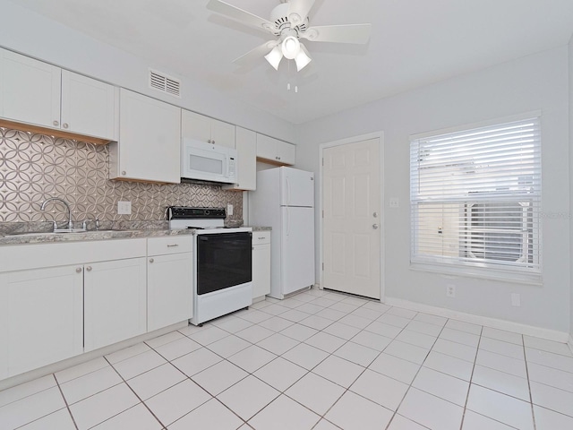 kitchen featuring tasteful backsplash, sink, white cabinets, white appliances, and ceiling fan