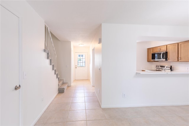 hallway with light tile patterned flooring