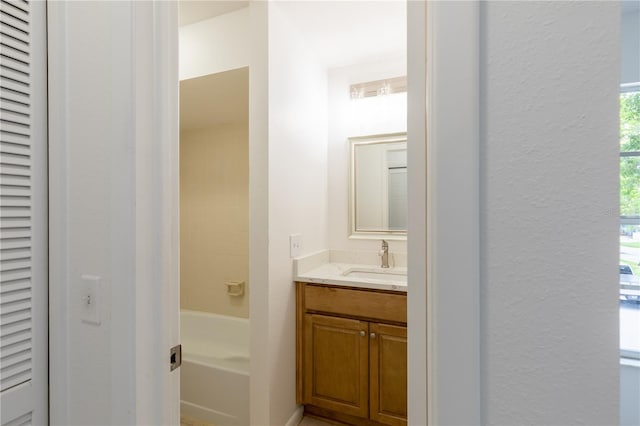 bathroom featuring shower with separate bathtub and vanity