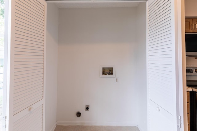 washroom with electric dryer hookup, hookup for a washing machine, and light tile patterned floors