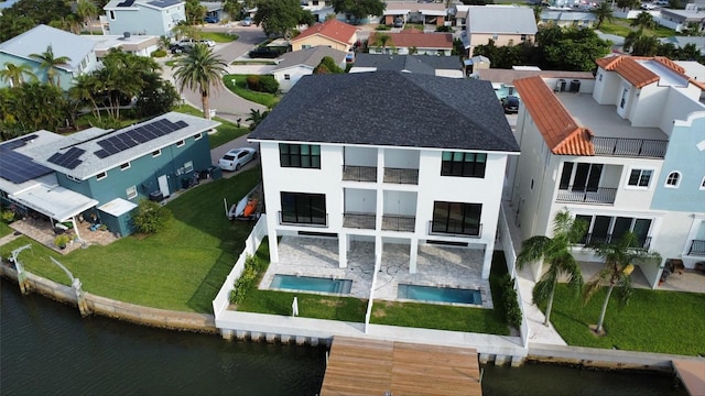 birds eye view of property with a water view