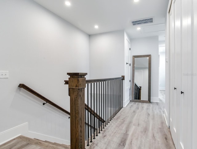 corridor featuring light hardwood / wood-style floors