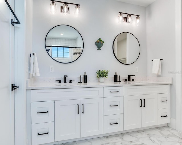 bathroom featuring vanity and a shower with door