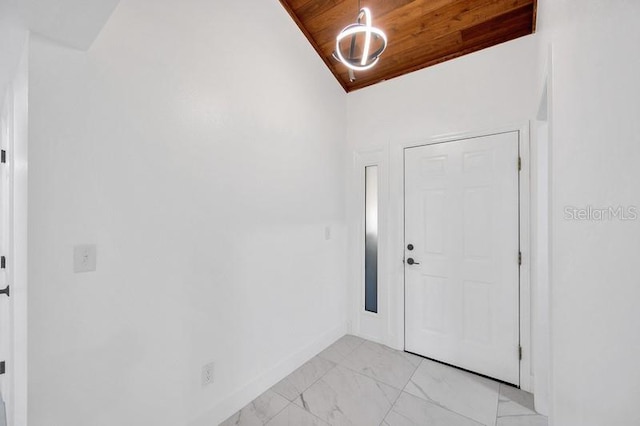 foyer featuring wood ceiling and lofted ceiling