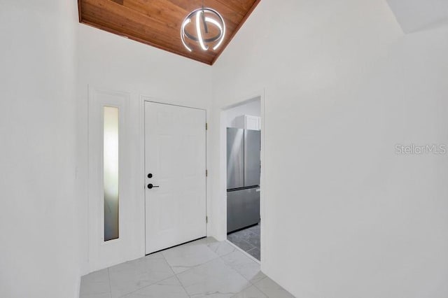 entryway with wooden ceiling and vaulted ceiling