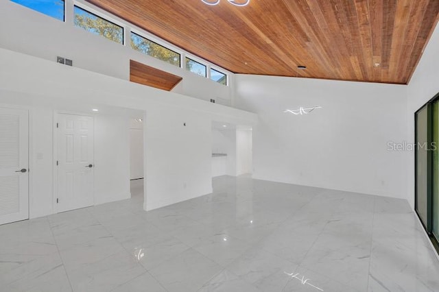 interior space with high vaulted ceiling and wooden ceiling