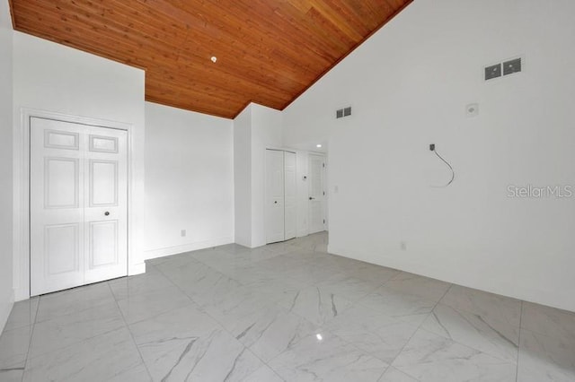 unfurnished room featuring high vaulted ceiling and wooden ceiling