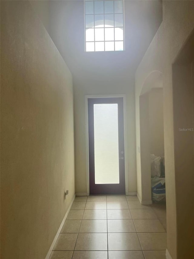 doorway featuring light tile patterned flooring