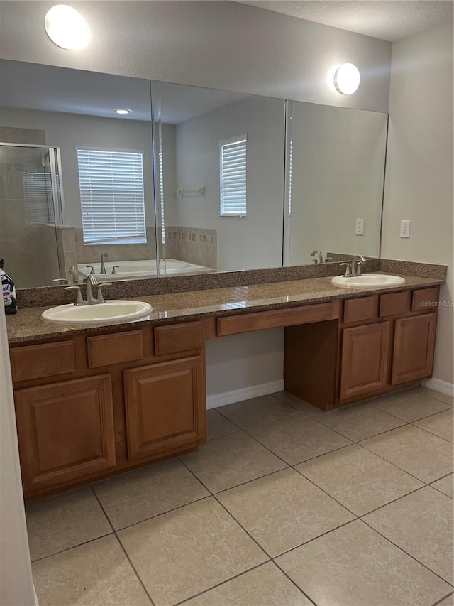 bathroom with shower with separate bathtub, tile patterned floors, and vanity