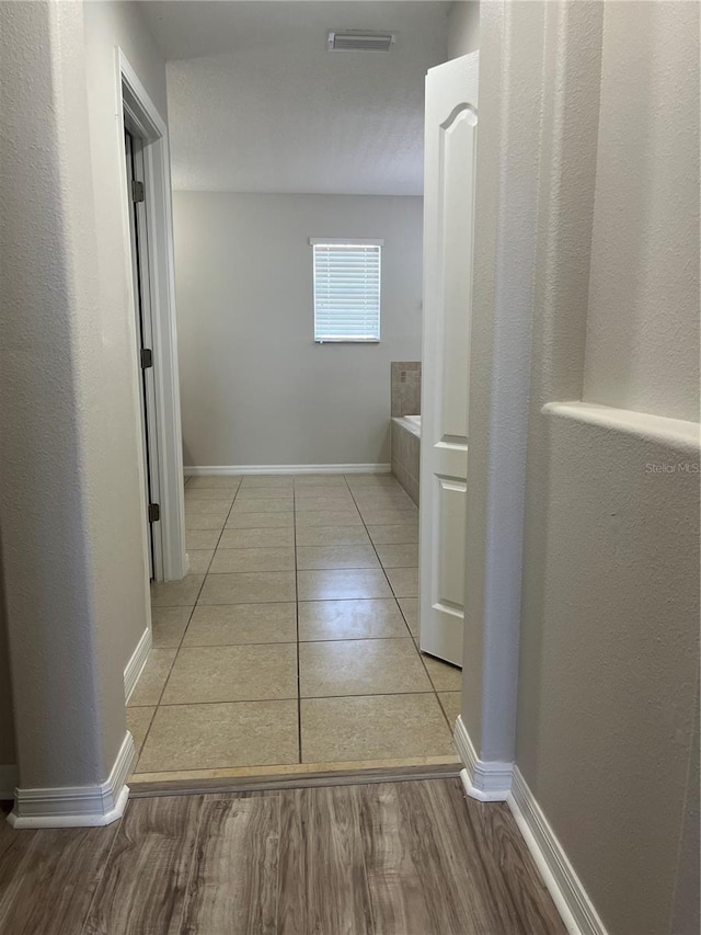 hall with light wood-type flooring