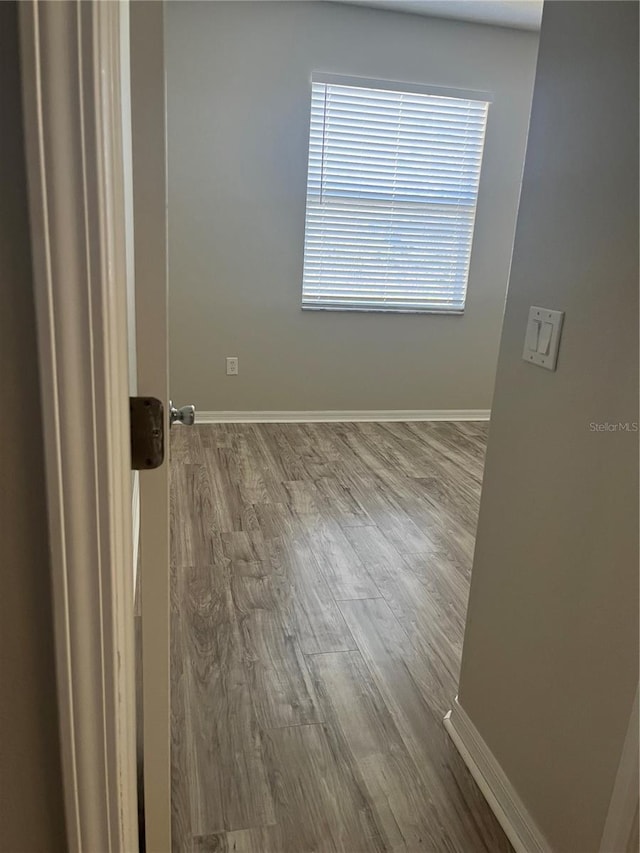 empty room featuring wood-type flooring