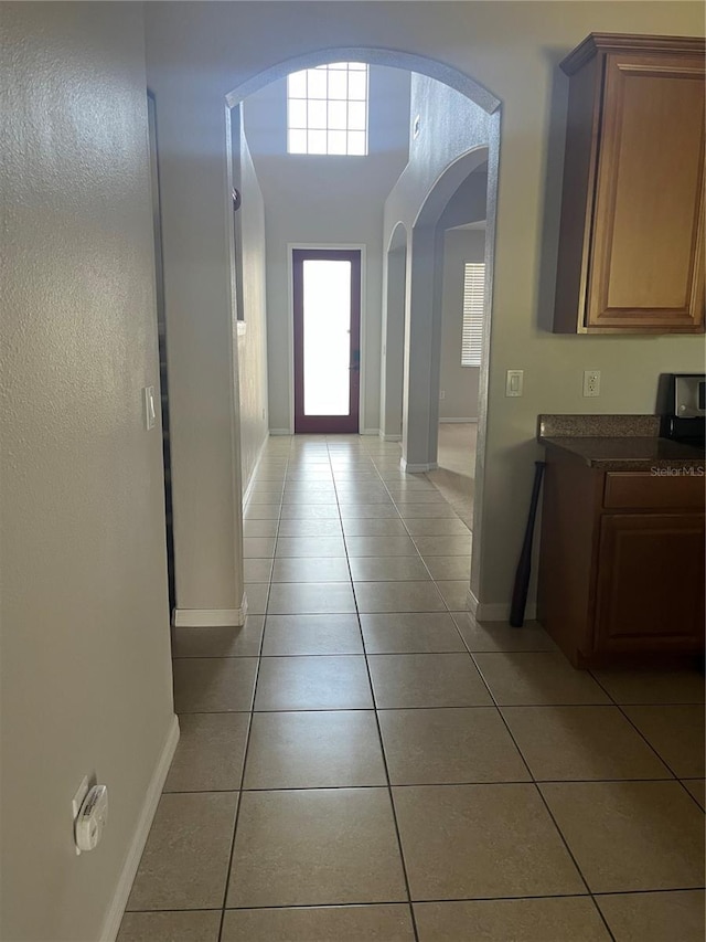 hallway with light tile patterned flooring