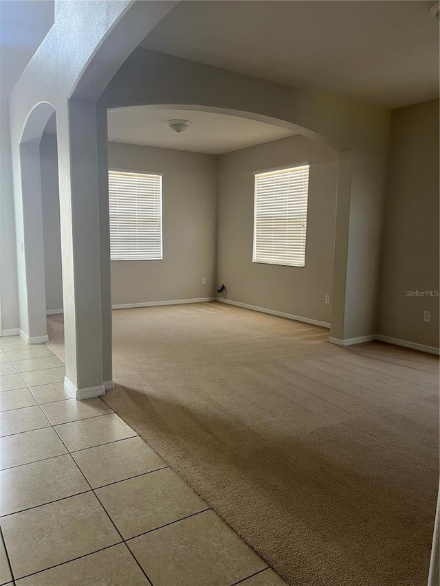 spare room with light colored carpet