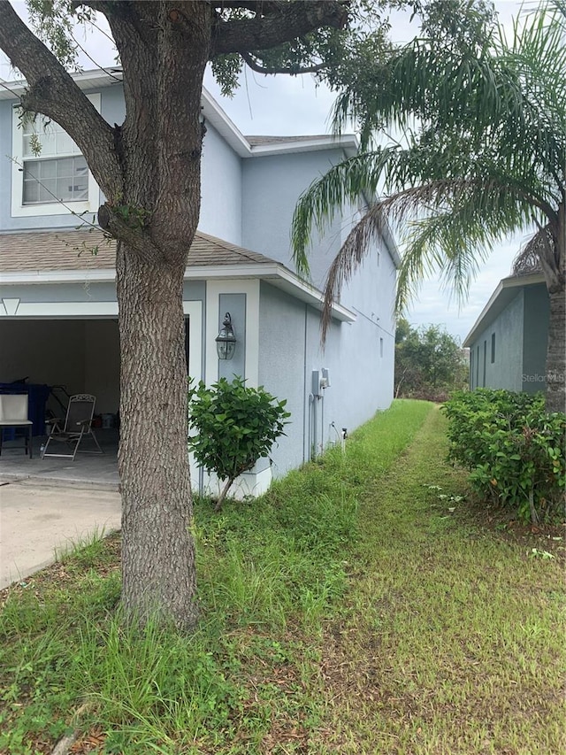 view of home's exterior with a lawn