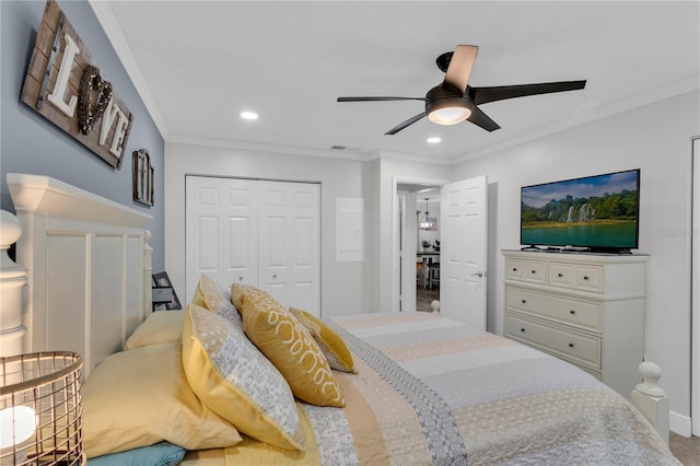 bedroom with ceiling fan, a closet, and ornamental molding