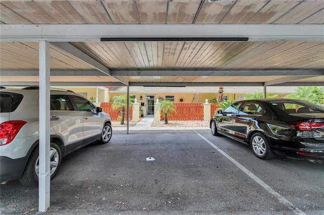 view of parking / parking lot with a carport