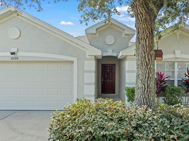 property entrance with a garage