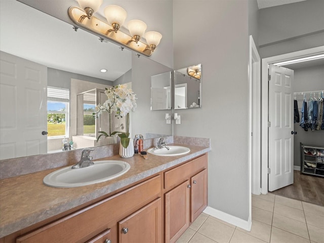 bathroom with tile patterned flooring and vanity