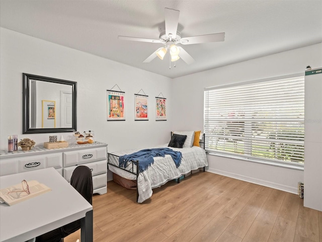 bedroom featuring ceiling fan and light hardwood / wood-style floors