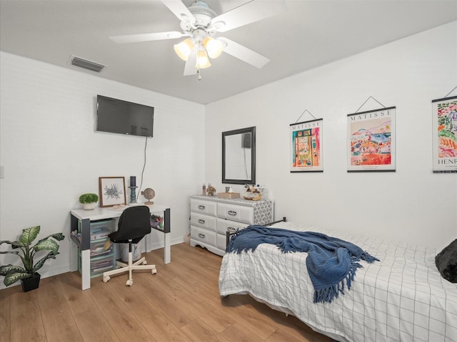 bedroom featuring ceiling fan and light hardwood / wood-style flooring