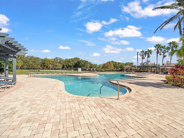 view of pool featuring a pergola and a patio