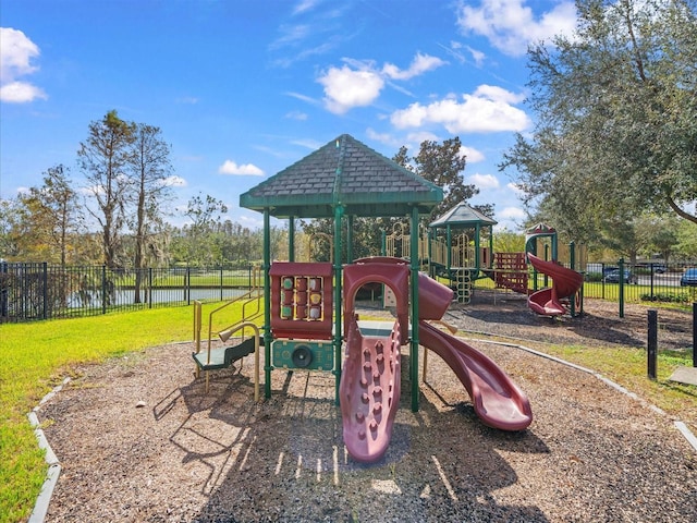 view of play area with a water view and a lawn