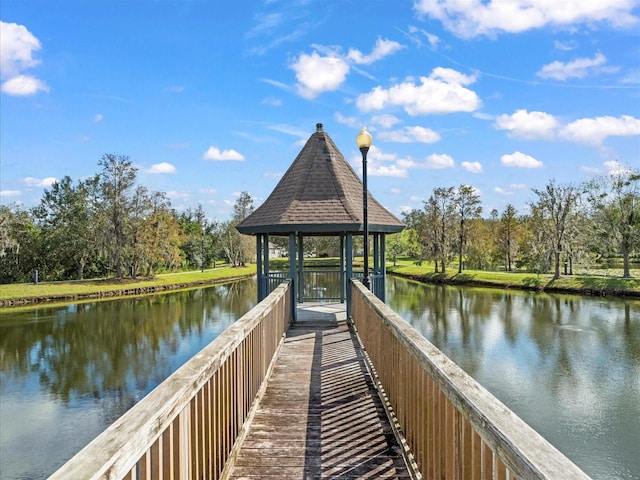 dock area with a gazebo and a water view