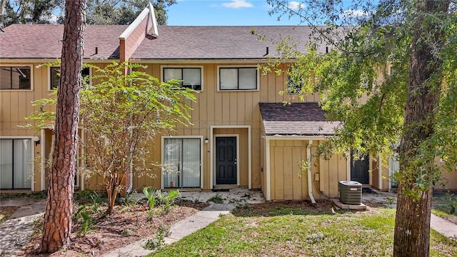 507 NW 39th Rd Unit 318, Gainesville, FL 32607 - view of front facade featuring roof with shingles and central air condition unit