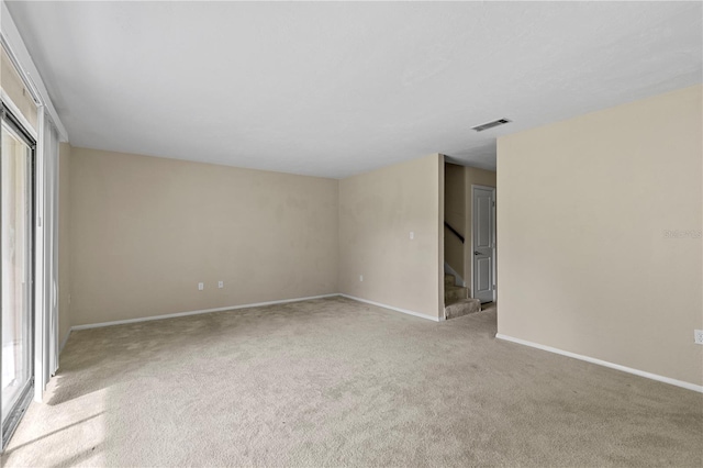 carpeted empty room with a wealth of natural light