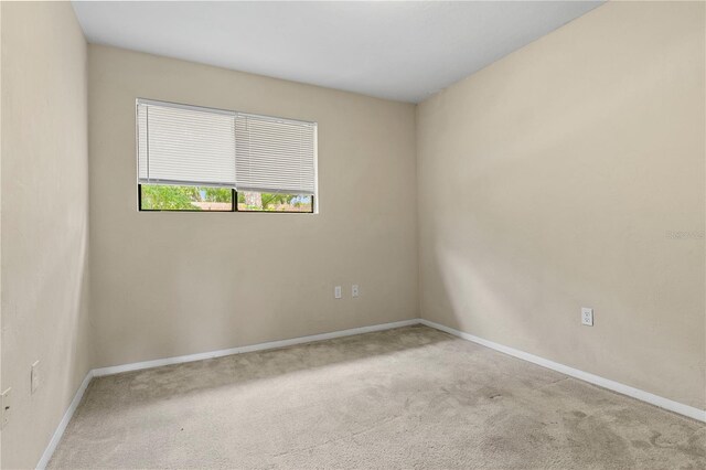 507 NW 39th Rd Unit 318, Gainesville, FL 32607 - spare room with carpet floors and baseboards