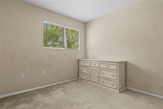 507 NW 39th Rd Unit 318, Gainesville, FL 32607 - unfurnished bedroom featuring light colored carpet and baseboards