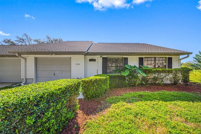 ranch-style home featuring a garage