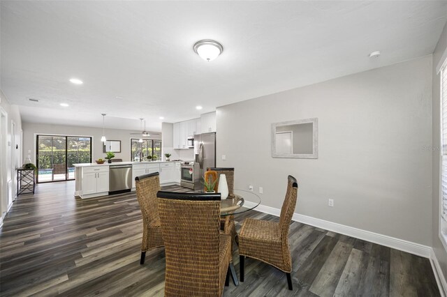 dining area featuring dark hardwood / wood-style floors