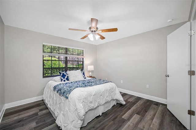 bedroom featuring dark hardwood / wood-style flooring and ceiling fan