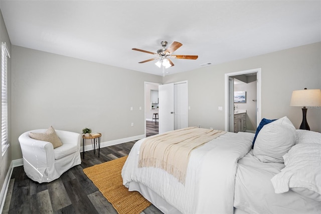 bedroom with dark hardwood / wood-style flooring, ceiling fan, a closet, and ensuite bath